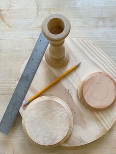 a wooden table topped with different types of woodworking supplies and a ruler next to it