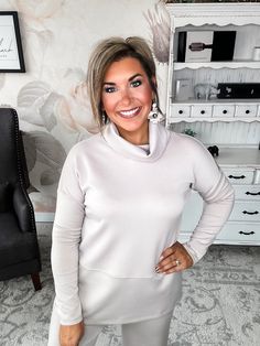 Slip into this cozy cowlneck top and you'll instantly be wrapped in softness. Lovingly crafted from a modal feel blend, this tunic feels like your favorite well-worn sweatshirt but looks polished enough for a night out. With a relaxed, flowy fit, side slits and long sleeves to keep you cozy, this top moves with you from couch to cocktails. The dramatic cowl neckline adds stylish drape and an alluring touch, perfect for showing off a statement necklace. Whether you're winding down on the weekend Cozy High Neck Soft Knit Top, Funnel Neck Soft Knit Tops For Layering, Relaxed Fit Soft Knit Funnel Neck Top, Cozy Soft Knit Funnel Neck Top, High Neck Soft Knit Top For Layering, Cozy Fit High Neck Top For Fall, Cozy Stretch Top With Funnel Neck, Chic Cozy Fit Tops For Loungewear, Casual Cowl Neck Top