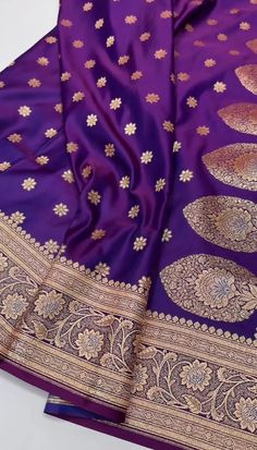 purple and gold banaram saree with floral design on the palan border