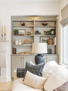 a living room filled with furniture and a fire place