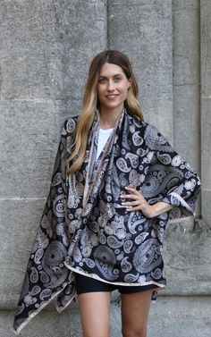 Made from silk, this lightweight scarf is a statement accessory for all occasion styling. Sprayed with a delicate paisley design, this elegant scarf can artfully draped around the shoulders or used as a lightweight shawl in the summer evenings. Care: Hand wash in cold water or dry clean only. Material: 100% Silk Size: 180 cm * 90 cm Elegant Pashmina Shawl For Spring, Elegant Pashmina Scarf With Paisley Print, Elegant Pashmina Scarves With Paisley Print, Spring Pashmina Shawl Scarf, Elegant Spring Pashmina Shawl, Bohemian Silk Scarf With Paisley Print, Elegant Patterned Shawl Scarves, Elegant Patterned Shawl Scarf, Black Summer Shawl Scarf