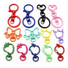 many different colored plastic scissors are arranged together