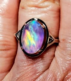 Stunning Rainbow Aurora Opal Ring, 8x12mm Lab Created Doublet Opal Rose Cut, See Video For Amazing Colors! 925 Sterling Silver Oval Design Ring, Rhodium Plated, Size 7. Gift Box Included. Iridescent Oval Jewelry For Anniversary, Iridescent Oval Jewelry For Anniversaries, Formal Iridescent Oval Ring, Rainbow Oval Jewelry For Anniversary, Handmade Iridescent Opal Ring As Gift, Iridescent Oval Sterling Silver Rings, Unique Iridescent Round Opal Ring, Multicolor Oval Opal Ring In Sterling Silver, Iridescent Oval Opal Gemstone Ring