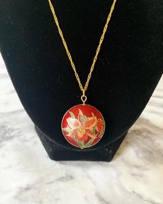 Vintage red iris cloisonné enamel puffy pendant on 18K gold plated wave chain. I cleaned the pendant to the best of my abilities. The head pin and jump ring are 18K gold plated. Comes in a box. Please keep in mind that the pendant itself is vintage so it may show some signs of age/wear which includes any signs of chipping or tarnishing. If you need a chain of another length, please select in the menu. If you need a chain length not listed, please send me a message. If you would like for me to ad Red Enamel Jewelry With Large Pendant, Collectible Red Medallion Jewelry, Red Hand Painted Pendant Necklaces, Red Medallion Necklace With Large Pendant, Red Medallion Jewelry For Gifts, Enamel Round Pendant Necklace Amulet, Handmade Gold Enamel Necklaces, Round Pendant Enamel Amulet Necklace, Enamel Amulet Necklace With Round Pendant