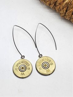 A personal favorite and new to the collection for 2023. 12 gauge shotshells mounted in stainless steel bezels and suspended from large stainless kidney wires. A minimal, clean, modern look. Lightweight, casual and for every day. Shown with Winchester brand 12 gauge. Options are Remington, Fiocchi and Federal. Choose from dropdown. See listings for standard kidney wire earrings using bullet casings too if you are looking for a smaller earring style. Only from SureShot! Always original! Kidney Wire Earrings, Bullet Casing, 12 Gauge, Small Earrings, Wire Earrings, Clean Modern, Winchester, Fashion Earrings, Stainless Steel