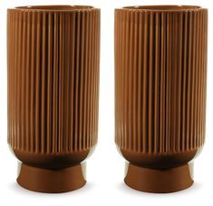 two brown vases sitting side by side on top of each other in front of a white background