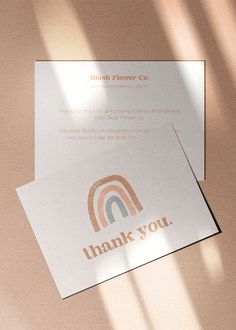 a thank card with the words thank you on it and a rainbow in the middle