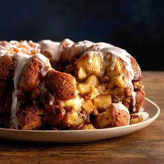 a bundt cake covered in icing on a plate