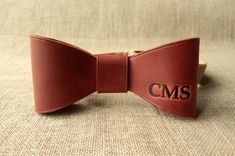 To learn more about my products, check out my Etsy store:https://www.etsy.com/shop/DFCraftsman?ref=seller-platform-mcnav ►Bow tie made of mat genuine cowhide leather (calf leather) with a waxy coating. WARNING:                                                                                                                                                          ►Product color may vary slightly from photo due to monitor settings. Classic Bow Tie For Suit Accessories As Gift, Classic Red Bow Tie For Gift, Classic Bow Tie Gift, Classic Bow Tie For Gifts, Dapper Bow For Groom, Brown Bow Tie For Father's Day Gift, Classic Ties With Bow Tie Back For Gifts, Father's Day Gift Bow Tie And Suit Accessories, Brown Bow Tie For Wedding