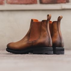 The classic coveted Chelsea boot featuring a modern styling. They are easy pull on and off which make these a quick and easy solution for any occasion. Features: Orange leather lining Box Calf Cognac Light Burnish Boot Cognac elastic City welt black heel/sole Handcrafted with Passion Goodyear Welt Construction Can be Resoled Classic Slip-on Boots Medium Width, Slip-on Calf Leather Boots With Rubber Heel Cap, Calf Leather Chelsea Boots With Heel Pull Tab, Fall Chelsea Boots With Leather Sole And Slip-on Design, Fall Chelsea Boots With Leather Sole, Fall Slip-on Chelsea Boots With Leather Sole, Classic Ankle-high Chelsea Boots With Rubber Heel Cap, Classic Brown Chelsea Boots With Heel Pull Tab, Calf Leather Slip-on Boots With Rubber Heel Cap