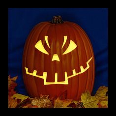 a carved pumpkin with glowing eyes on it