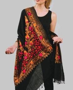 Our Embroidered Wool Shawl features fine embroidery on a soft blend of 80% wool and 20% viscose. This classically beautiful shawl showcases the intricate embroidery traditions in vibrant jewel tones on a black base. COLOR Black & Ruby DIMENSIONS 28" x 78" Black Ruby, Fine Embroidery, Embroidered Shawl, Embroidered Wool, Wool Shawl, Intricate Embroidery, Jewel Tones, Shawls And Wraps, Scarf Wrap