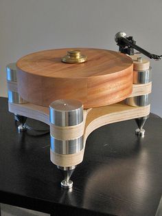 an old record player sitting on top of a table