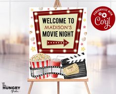 a welcome sign to madison's movie night with popcorn, sodas and drinks