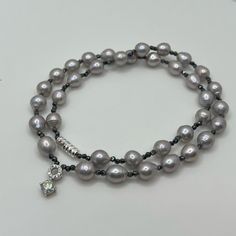 Handmade Necklace/Double Bracelet: Made With Light Gray Freshwater Natural Pearls, Organic Hematite Gemstone Beads, White Gold Over S925 0.5 Carat Moissanite Diamond Pendant, Luxurious 18k White Gold Over S925 (Solid Sterling Silver) Screw Clasp! Pearls Size Approx 6.6mm, Hematite Beads 1.8mm! Fixed Length 16”. Please Note, This Necklace Made With Natural Pearls! Natural Pearls Are Products Of Nature And Can Have Birthmarks Or Minor Variationsif You Mind Don’t Buy!! Can Be Used As Necklace Or As Luxury Hand-strung Silver Jewelry, Silver Single Strand Pearl Bracelet, Silver Double Strand Hand-strung Beaded Bracelets, Elegant Silver Hematite Stretch Bracelet, Hematite And Pearl Jewelry, Silver Double Strand Hand-strung Necklace, Formal Gray Pearl Necklace, Hand-strung Hematite Beaded Bracelets, Adjustable Hand-strung Hematite Beaded Bracelets