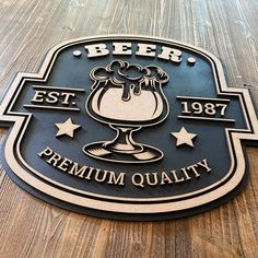 a beer sign on the side of a wooden table that says beer est 1989 premium quality