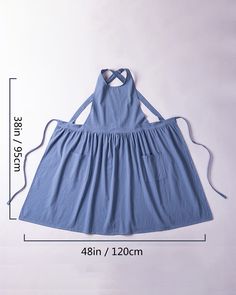 an apron dress size guide with measurements for the front and back, shown in blue