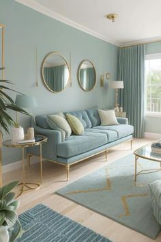 a living room with blue couches and mirrors on the wall above them, along with two tables