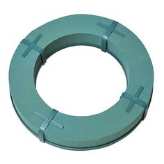 an aqua colored metal ring with crosses on it