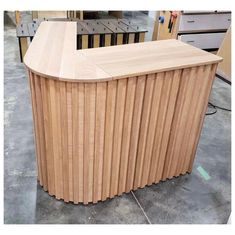 a wooden counter sitting on top of a floor