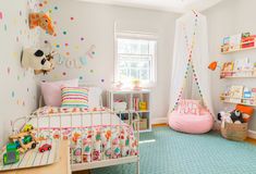 a child's bedroom decorated in pastel colors