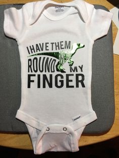 "Cutest baby Onsie for a boy or girl. \" I have them Raptor around my finger\". Shirt is an adorable gift idea for Infants or Toddlers. Different HTV vinyl color options available. Shown in Green Foil, 0-12 months to Toddler sizes available. Please message me with any questions." Cotton Onesie With Dinosaur Print For Playtime, White Cotton Onesie With Dinosaur Print, Cute Fitted Dinosaur Print Onesie, Cute White Onesie With Dinosaur Print, Raptor Dinosaur, Funny Baby Gifts, Baby Onsie, Baby Sleepers, One Piece Bodysuit