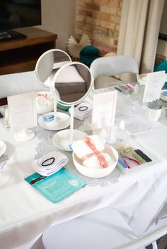 the table is set with plates, napkins and place settings for guests to eat