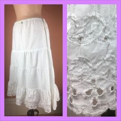 This was undoubtedly an underskirt originally, but it's too pretty and wearable to keep hidden.  Crisp and white, the skirt is made of a cotton sheeting fabric, with lovely embroidered accents. Hooks closed on the side. Elastic waist stretches from 27 to 30".  It is a bit large for this form and so is sitting at the hip.  In very good vintage condition with one repair beneath the floral appliqué where a small tear has been patched (photo 9),  and a bit of mending/reinforcement hand stitching at Spring Cotton Skirt With Broderie Anglaise, White Broderie Anglaise Cotton Skirt, Vintage Skirted Petticoat With Lined Skirt, White Cotton Skirt With Broderie Anglaise, Vintage Ruffled Petticoat For Summer, Vintage Summer Petticoat With Ruffled Skirt, Vintage White Skirt With Ruffles, Cotton Skirt For Summer Wedding, White Cotton Wedding Skirt