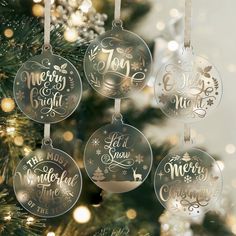 four ornaments hanging from a christmas tree