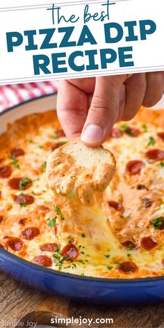 a hand dipping a piece of pizza into a blue casserole dish with text overlay