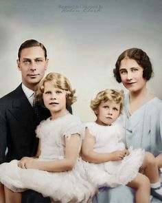 an old photo of three people and two children