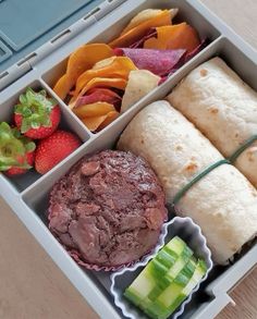 an open lunch box filled with different types of food