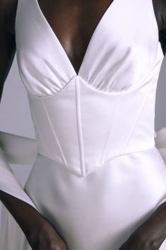 Italian double faced liquid satin corset bias slip gown with flower and detachable streamer. Shown in Silk White. Sleeveless Satin Gown With Boned Bodice, Elegant Corset With Boned Bodice And Spaghetti Straps, Gala Slip Dress With Fitted Bodice And Sweetheart Neckline, Gala Slip Dress With Sweetheart Neckline And Fitted Bodice, Satin Wedding Dress With Boning, Elegant Corset With Spaghetti Straps And Lined Bodice, Fitted Satin Bodice For Party, Satin Bodice For Party, Fitted Satin Wedding Dress With Spaghetti Straps