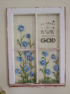 a window with blue flowers painted on it