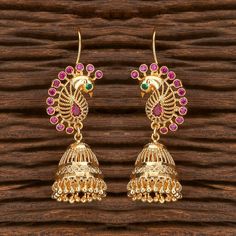 Height = 42 mm || Width = 15 mm Peacock Design Antique Earring Gorgeous Gold Earrings with Pearl drops Each piece is handcrafted . All the raw material used in this product is of high quality and is handcrafted with love. 100% Satisfaction Guarantee: Long Lasting Plating, High-Quality Stones. Gifting: This pair of earrings come in a beautiful gift pack, making it an ideal gift for birthday, wedding anniversary or wedding gift. Occasion: Perfect choice for any Indian occasion. Care: It is advisab Temple Jewelry Jhumkas As A Gift, Gift Temple Jewelry Jhumkas, Festive Round Temple Jewelry Earrings, Round Earrings For Puja And Festivals, Temple Jewelry Style Peacock Design Jhumkas, Peacock Design Earrings For Puja Festivals, Temple Jewelry Style Jhumkas With Peacock Design, Temple Jewelry Peacock Design Jhumkas, Temple Jewelry Peacock Jhumkas