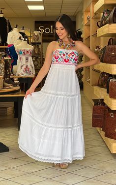 This Beautiful Strapless Dress boasts a Traditional Mexican floral design combined with a modern style dress. The corrugated skirt combined with the strapless embroidered top makes it fun and flirty. It's made out of fine Mexican corrugated cotton and has elastic on the back for a tighter fit. It has lace details throughout. This dress is handmade and completely hand embroidered by Mexican Artisans in Puebla, Mexico. More available dresses here: https://www.etsy.com/es/shop/SoleiEthnic?ref=selle Mexican Wedding Dress Guest, Festival Embroidered Maxi Dress With Embroidered Hem, Festival Embroidered Hem Maxi Dress, Festival Maxi Embroidered Dress With Embroidered Hem, Festival Maxi Length Embroidered Dress, Bohemian Sleeveless Dress With Embroidered Hem, Bohemian Sleeveless Embroidered Dress, Multicolor Embroidered Summer Maxi Dress, Fitted Embroidered Bohemian Boho Dress