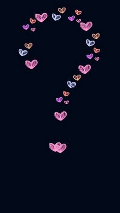 many small hearts are arranged in the shape of a letter s on a black background