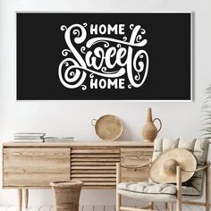 a black and white poster with the words home sweet home on it's wall