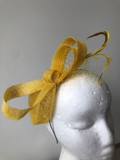 Item: Yellow sinamay loop fascinator with feathers and netting on a silver metal headband!  Size: Approx 10ms high  Postage: The postage in this listing is regular post via Australia Post. Please allow approximately 7-10 days for postage at Australia Post (for metro areas) and more for regional areas.  If you require express post, please purchase here.  https://www.etsy.com/au/listing/208216644/express-post-your-fascinator?ref=shop_home_active_1&ga_search_query=express%2Bpost  Express post via A Cream Fascinator, Double Headband, Fascinator Hats Diy, Metal Headband, Human Head, Fascinator Headband, Silk Headband, Australia Post, Metal Headbands