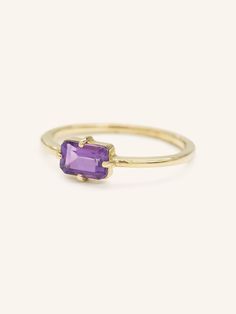 A unique spin on a modern classic. The Lady's Mantle Amethyst ring stuns with an amethyst center stone of a rich purple. It's a great present for those born in the month of love, February. Timeless Purple Rings Perfect For Gifts, Timeless Purple Rings As Gifts, Timeless Purple Rings For Gifts, Luxury Purple Amethyst Birthstone Ring, 14k Gold Purple Emerald Cut Rings, Purple 14k Gold Ring With Emerald Cut, Purple 14k Gold Rings With Emerald Cut, Timeless Purple 14k Gold Rings, Modern Purple 14k Gold Jewelry