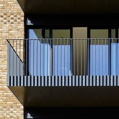 an apartment building with balcony and balconies