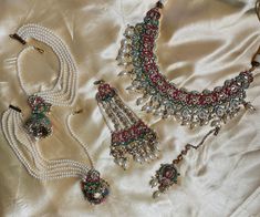 This necklace is the perfect wedding accessory to have and is a semi bridal set that comes with matching tikka, passa, jhumka and choker. It can be worn separately for a simple look but can be worn together for a statement look! Made of kundan/polki stones along with multi colored beads it can match any outfit! Festive Multicolor Bridal Sets With Stone Work, Multicolor Tilla Lehenga For Wedding, Multicolor Wedding Lehenga With Tilla, Heavy Multicolor Bridal Sets For Festive Occasions, Traditional Multicolor Bridal Sets For Wedding, Heavy Multicolor Bridal Sets For Wedding, Multicolor Lehenga With Stone Work For Wedding, Multicolor Kundan Hand Set Bridal Sets, Hand Set Multicolor Kundan Bridal Sets