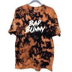 *BAD BUNNY inspired custom t-shirt Perfect for Bad Bunny and Reggaeton lovers. The shirts are made with a Gildan heavy cotton t-shirt and heat transfer vinyl. This custom t-shirt will not look exactly like the picture but the same style because of the bleach tie-dye also meaning every t-shirt will be unique. -Design FRONT: Bad Bunny written BOTH ARMS: Bad Bunny Logo **IF YOU LIKE A LOOSE & BAGGY FIT, WE RECOMMEND GETTING A SIZE BIGGER *REFUND & RETURN POLICY: * Since these are made to or Bad Bunny Logo, Bad Bunny Merch, Bleached Shirt, Bunny Logo, Bleach Tie Dye, Bad Bunny, Same Style, Transfer Vinyl, Baggy Fits