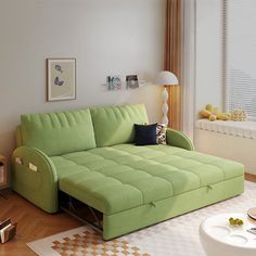 a living room with a green couch in it