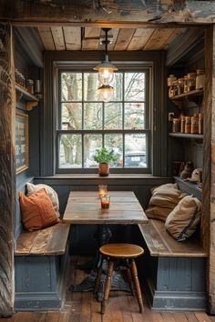 a table and bench in a small room