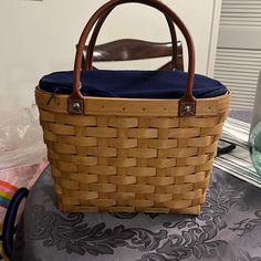 a woven basket sitting on top of a table