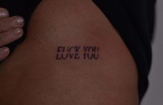 a woman's arm with the words blow you love you written on her back