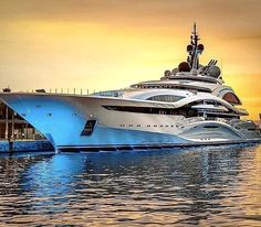 a large white boat floating on top of a body of water