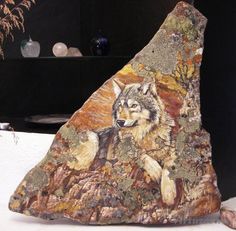 a rock with a wolf painted on it