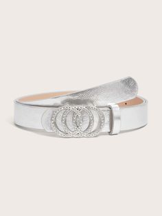 Add a pop of glamour with the Rhinestone & Circle Decor Belt. This medium-width belt features eye-catching rhinestone and circle detailing, perfect for elevating any outfit. Crafted from durable PU leather with a chic PU buckle, it offers a stylish non-stretch fit. Ideal for adding a bold touch to both casual and dressy looks, this belt is a must-have accessory for a standout wardrobe. 100% Polyurethane Please allow 3-5 business days to process and ship. in cm : Size Height Width Length 90 2.7 2.7 112 Elegant Adjustable Belt With Rhinestones, Elegant Silver Belt With Rhinestones, Elegant Evening Belts With Rhinestones, Luxury Silver Belt With Rhinestones, Trendy Silver Party Belt, Trendy Silver Belt For Party, Trendy Silver Belts For Party, Silver Rhinestone Belt For Party, Chic Silver Belts For Formal Occasions